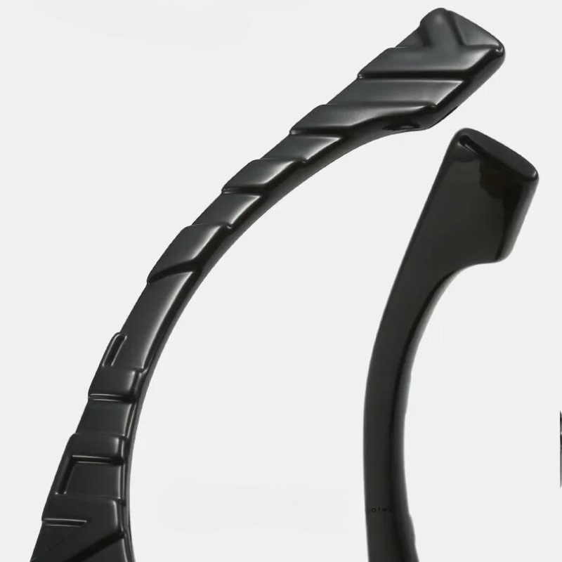 Close-up of two black plastic headbands against a white background, one with a ridged, textured surface and the other with a smooth, plain finish—ideal for pairing with vintage sunglasses featuring UV400 protection.