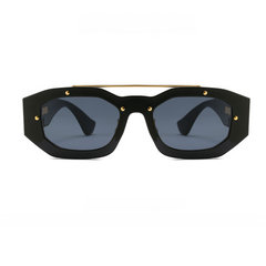 Black geometric sunglasses with thick frames, dark blue-tinted scratch-resistant lenses, gold accents at the corners, and a thin gold bar across the top. The bold, modern style offers both standout looks and reliable UV400 protection.
