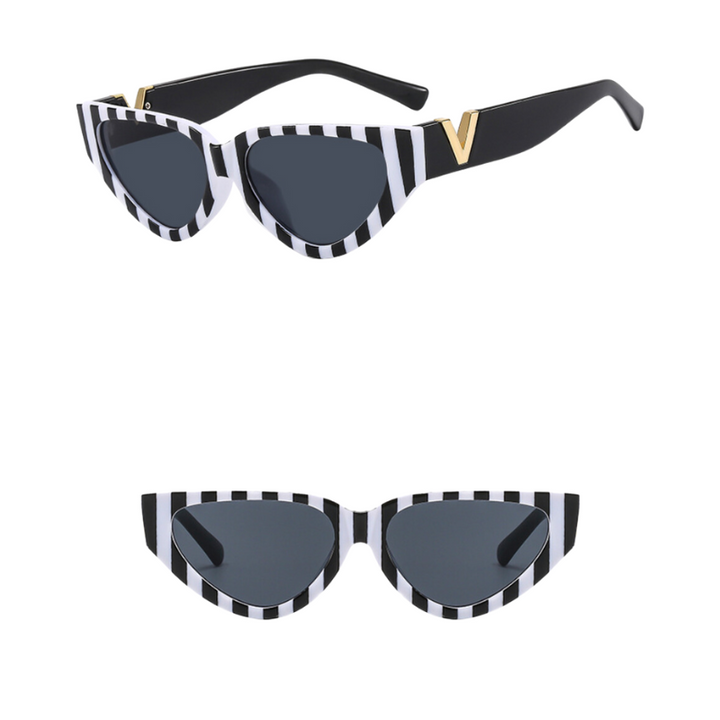 Vintage cat eye sunglasses with a bold frame featuring black and white vertical stripes, dark UV400 protection lenses, and a gold V detail on the arms. Shown from side (top) and front view (bottom) on a white background.