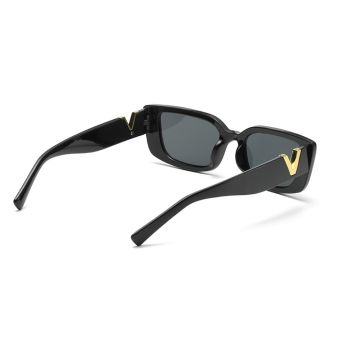 Black rectangular designer sunglasses with geometric frames and dark lenses offer UV400 protection, featuring gold V-shaped accents on the temples. Displayed on a white background.