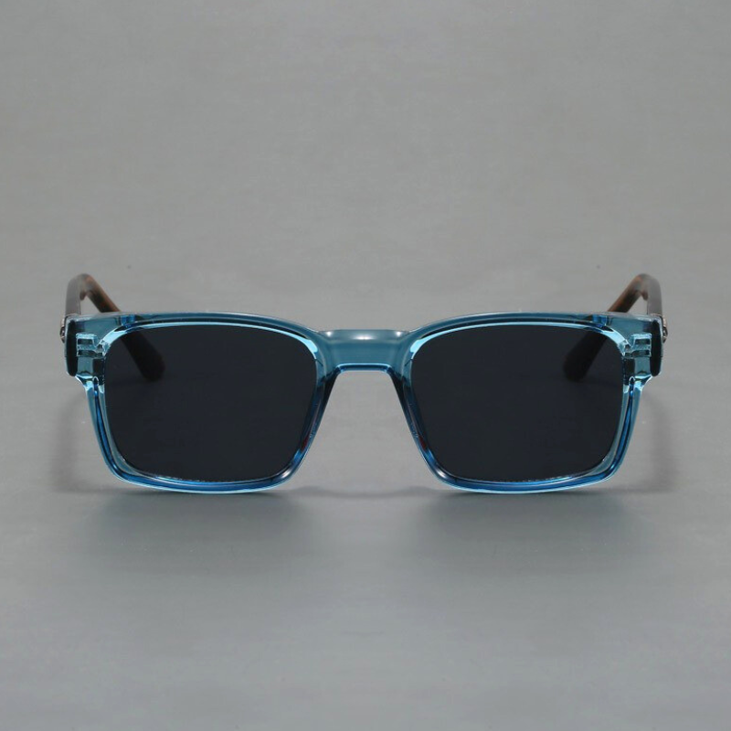 A pair of rectangular sunglasses with light blue translucent, durable frames and black lenses, offering UV400 protection, shown against a plain gray background.