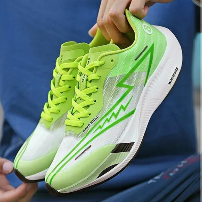 A person holds a pair of bright green and white athletic running shoes with lime green laces and bold zigzag stripes. Featuring Super foam Rebound, these new shoes promise a sporty look and exceptional comfort.