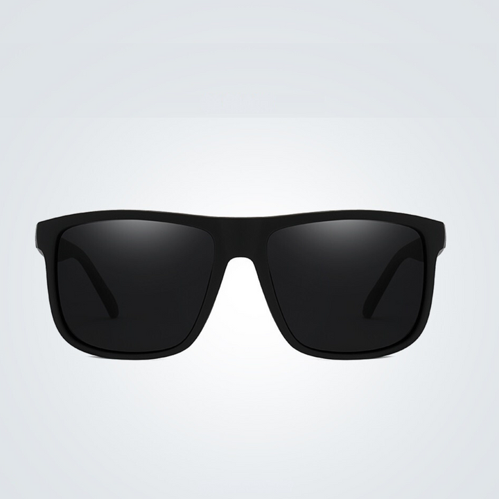 A pair of stylish black rectangular sunglasses with dark UV400 lenses is centered on a plain light gray background.