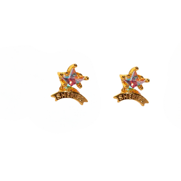 A pair of gold sheriff badge-shaped statement earrings with multicolored gemstones and the word SHERIFF engraved on a banner below each star.