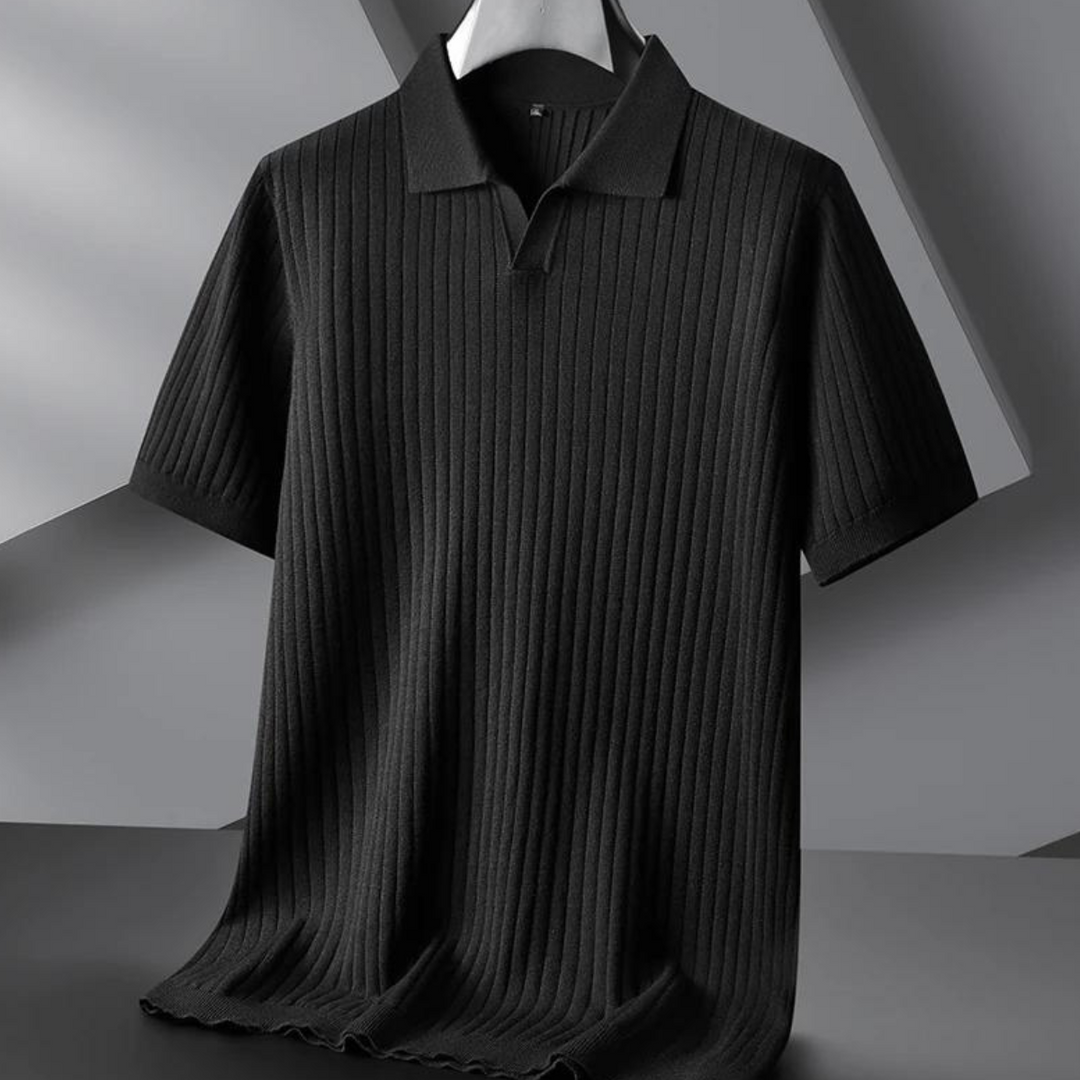A black, short-sleeved ribbed knit polo shirt is displayed on a hanger against a modern, geometric gray background. Perfect for the urban professional, it features a collar and a subtle vertical stripe texture.