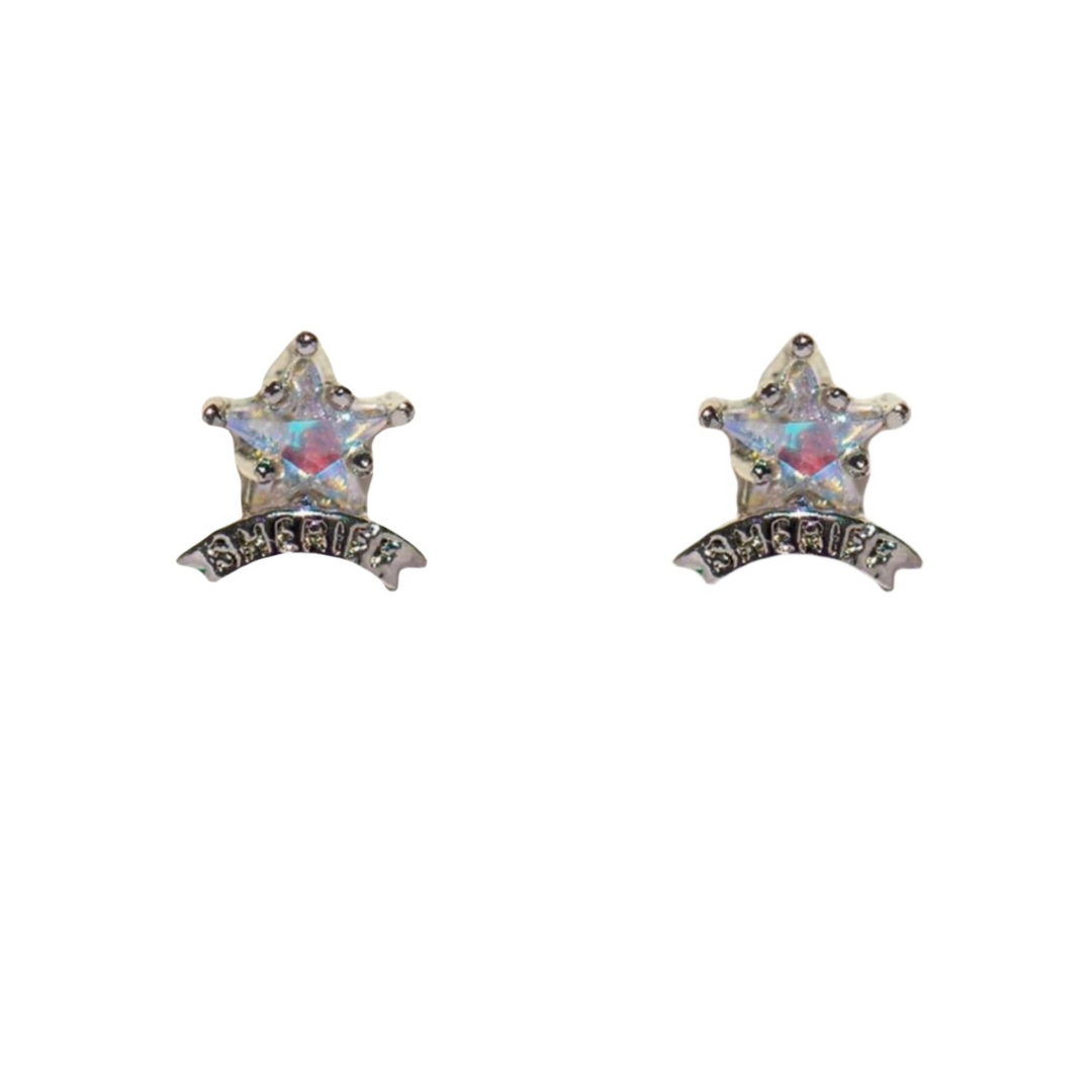 A pair of silver statement earrings shaped like five-pointed stars with iridescent centers, each featuring a curved banner below that reads SHERIFF in black letters. The earrings are displayed on a white background.