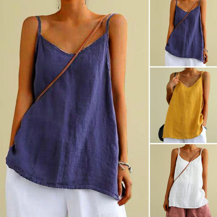 A woman wears an urban-chic camisole with spaghetti straps and a loose fit, shown in purple, yellow, and white. She styles the streetwear-inspired tops with white shorts and carries a tan crossbody bag.
