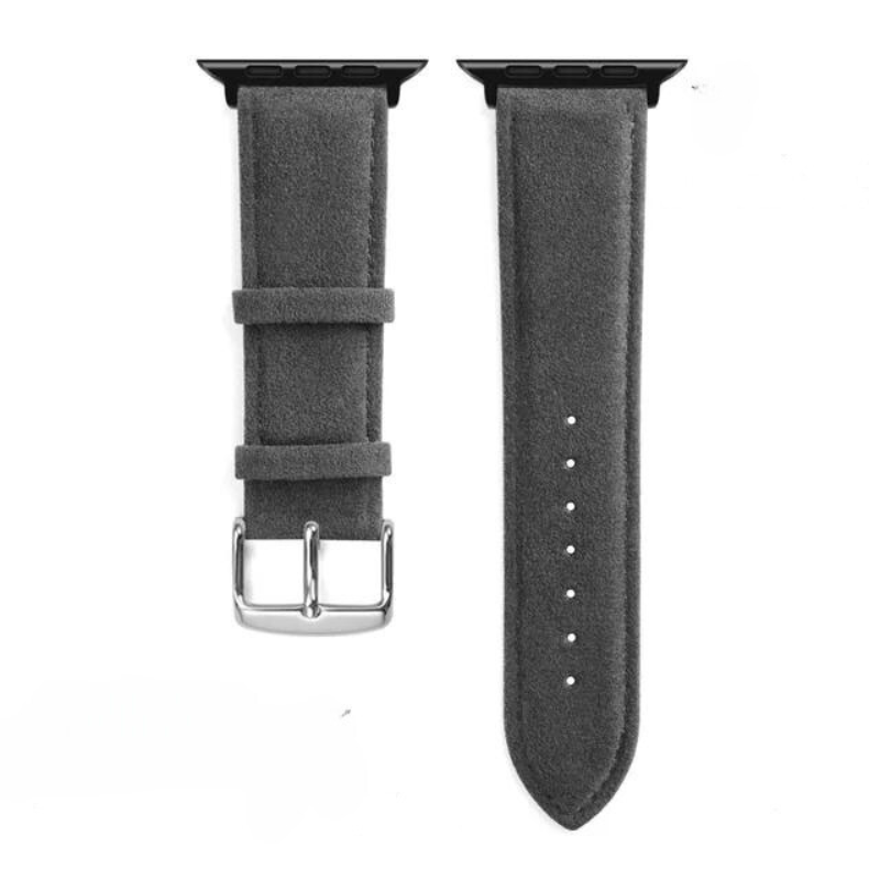 Two pieces of a gray Alcantara watch band with black connectors; one piece has a stainless steel buckle and two loops, the other features six adjustment holes for a precision fit.