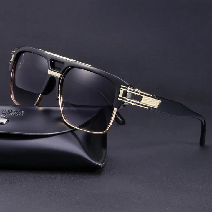 A pair of black geometric sunglasses with gold accents on the frame and arms, featuring scratch-resistant lenses, placed on a black hard case against a dark background.