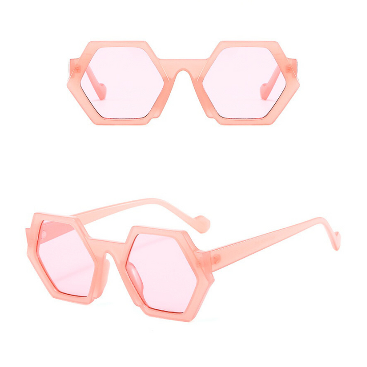 Trend-forward hexagonal pink sunglasses with translucent pink lenses and frames, featuring UV400 protection, shown from the front and side angles on a white background.