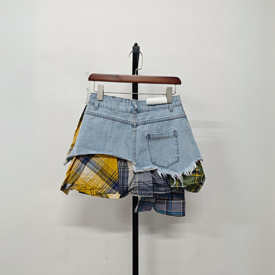 A patchwork skirt featuring torn pieces, blending denim and plaid for an eclectic fashion statement.