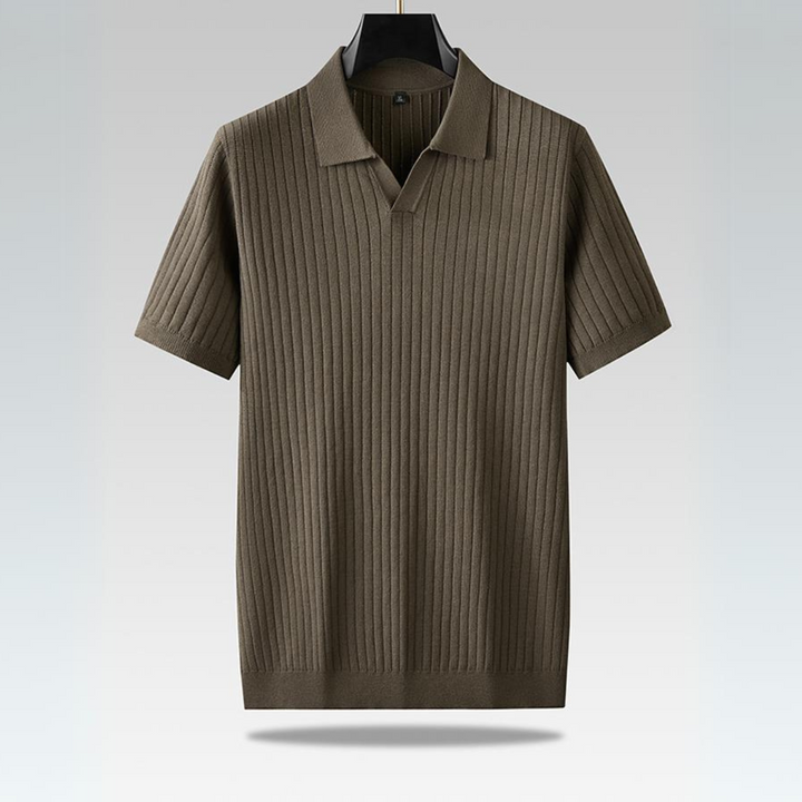 A short-sleeved, olive-green ribbed knit polo shirt with a vertical pattern, perfect for the urban professional, hanging on a black hanger against a light gradient background.