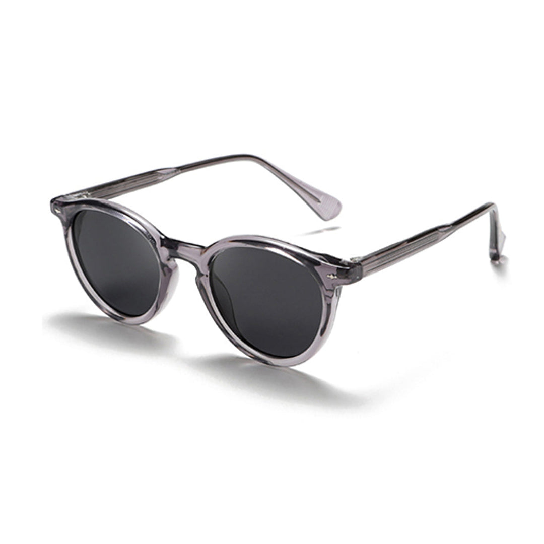 A pair of fashionable eyewear: round frame sunglasses with dark lenses and translucent gray frames, displayed at an angle on a white background.