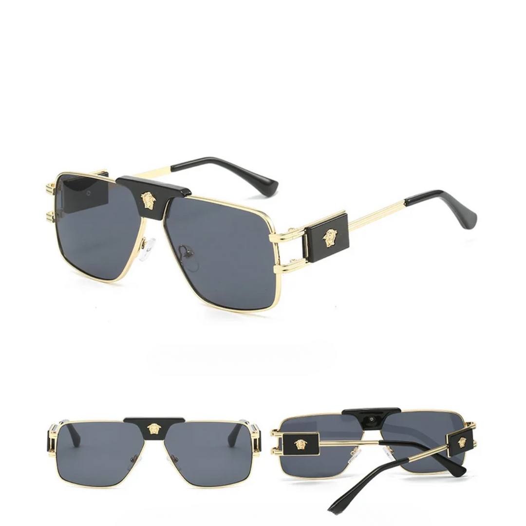 Three views of bold sunglasses with premium metal frames, black accents on the temples, and gray UV400 protection lenses. The temples feature a gold Medusa head emblem on black plaques for a striking, modern look.