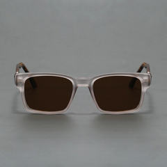 A pair of square, transparent-framed sunglasses with a modern design and dark tinted lenses offering UV400 protection, displayed against a plain gray background.