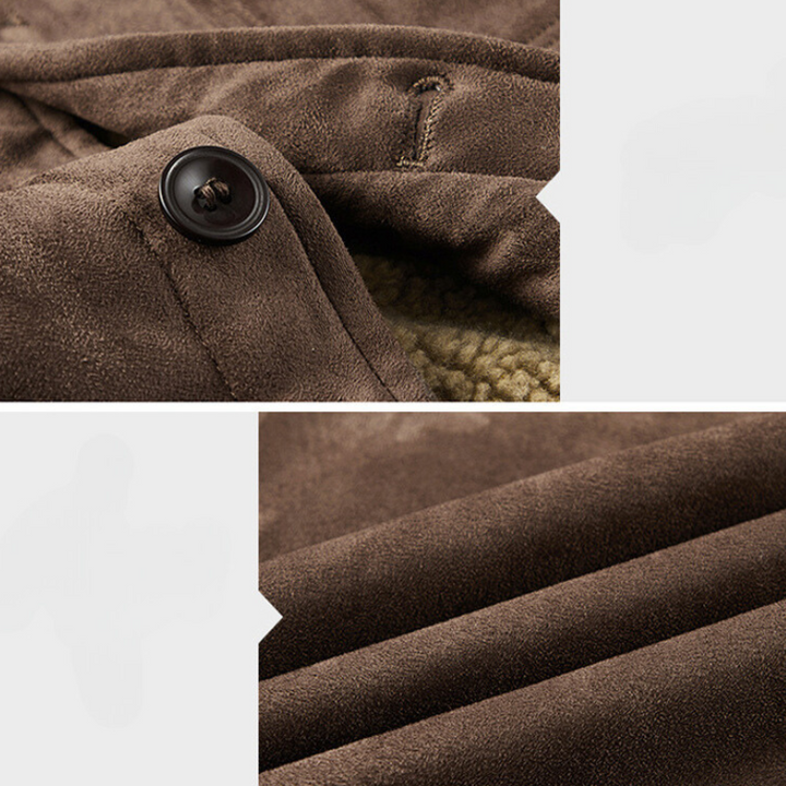 Close-up of a brown suede-like fabric coat with a buttoned collar, visible stitching, and soft texture. The lower part highlights the smooth, folded material and structured fit.