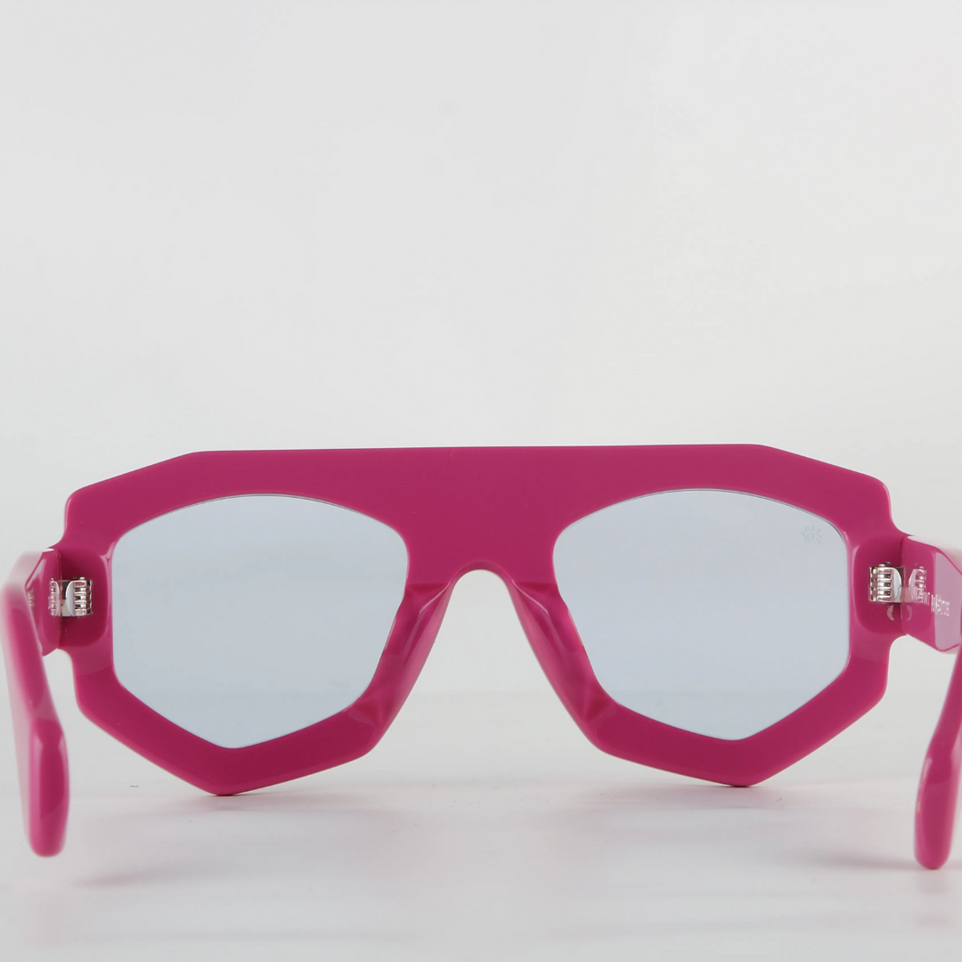 Bright pink futuristic sunglasses with thick geometric acetate frames and light-tinted lenses, featuring UV400 protection, shown facing forward against a plain white background.
