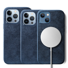 Three blue suede finish phone cases for iPhones are shown, each with a protective design. One case features a round white MagSafe charger attached to its back, and the camera cutouts indicate compatibility with different iPhone models.