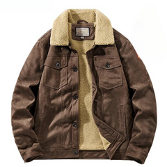 A brown suede jacket with a light beige Sherpa lining and collar, featuring buttoned chest pockets, front buttons, and side pockets. The jacket is laid flat with the front partially open to show the cozy lining.