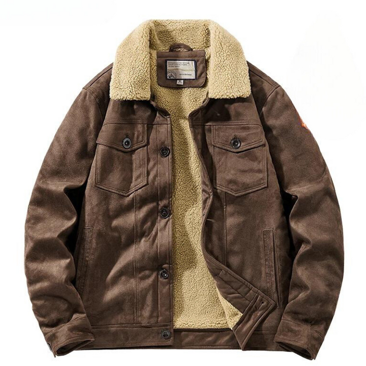 A brown suede jacket with a light beige Sherpa lining and collar, featuring buttoned chest pockets, front buttons, and side pockets. The jacket is laid flat with the front partially open to show the cozy lining.