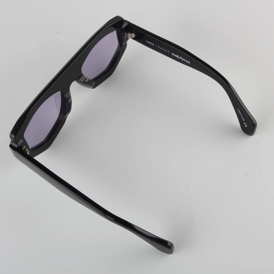 Black rectangular sunglasses with a geometric frame are shown from an angled top view on a plain white background. The acetate build and dark tinted lenses offer both style and UV400 protection.
