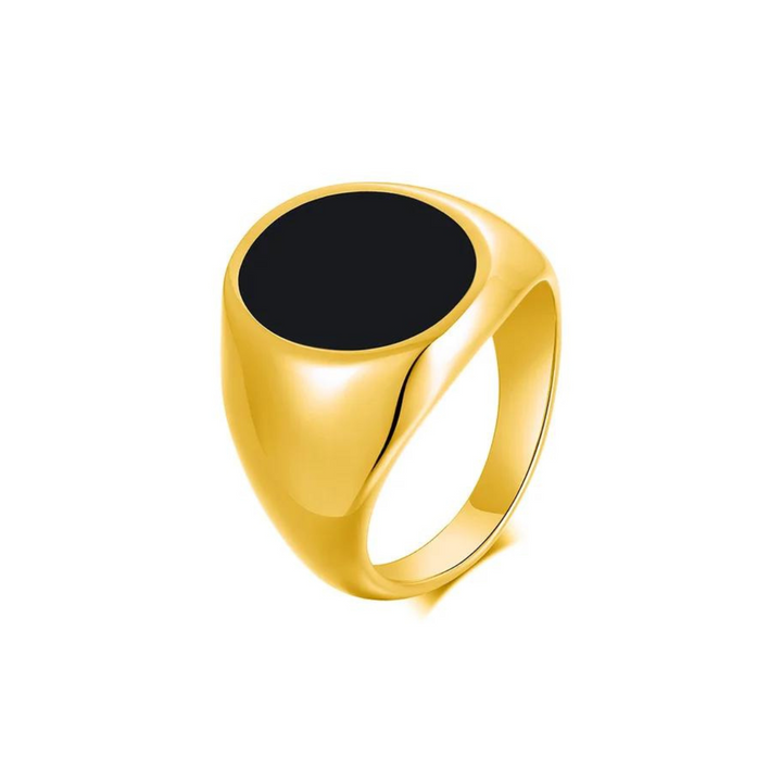 A gold signet ring with a smooth, oval-shaped black onyx stone set on top features a polished finish, displayed on a white background.