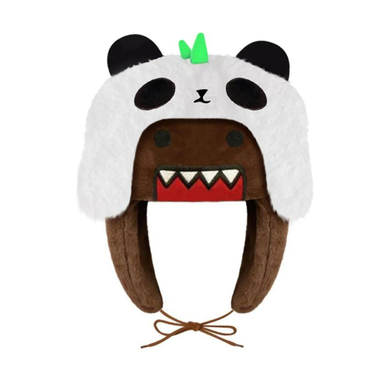 A plush winter hat made from soft plush material with a brown base, adjustable ear flaps, and tie strings. It features a white panda face with black ears, green detail on top, and sharp-toothed mouth across the forehead for fun winter styling.