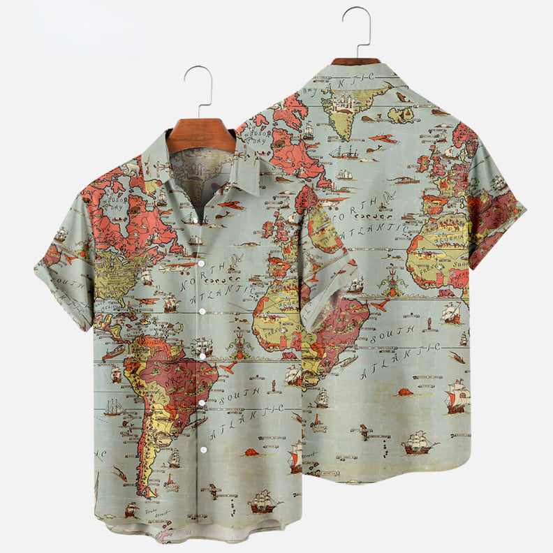 Two short-sleeve button-up Hawaiian shirts on hangers feature a vintage world map print with continents, oceans, and illustrated ships in muted red, yellow, and green tones—perfect for updating your summer wardrobe.