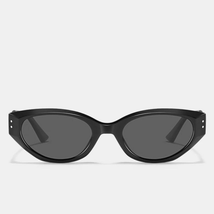 Black cat-eye sunglasses with dark, scratch-resistant lenses and UV400 protection, displayed on a plain white background. The glossy frame features small silver dots on the front corners near the hinges.