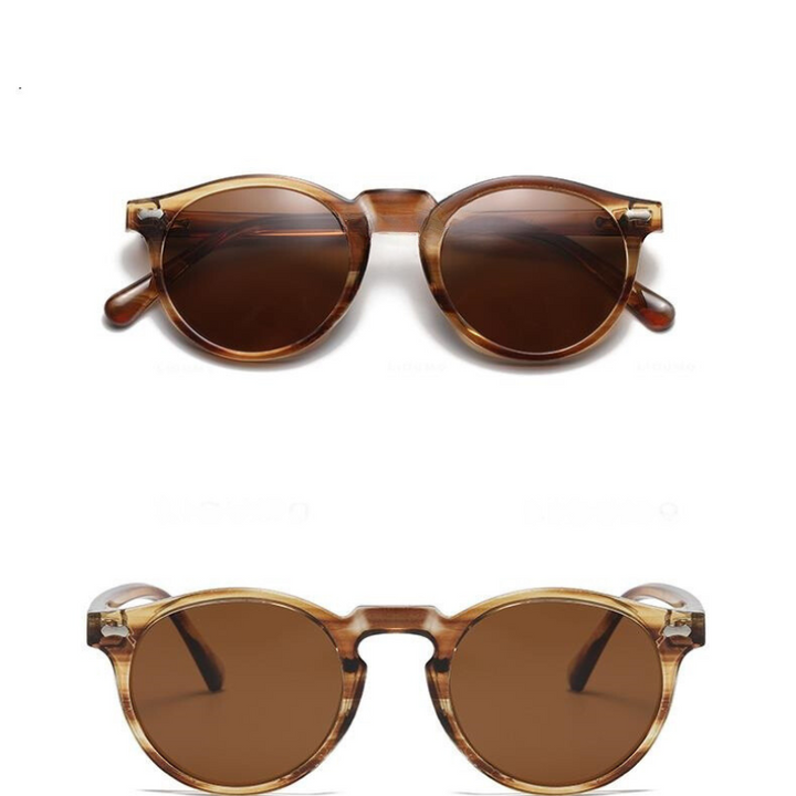 Two pairs of round frame sunglasses with brown lenses and translucent frames are displayed against a white background, one above the other, showcasing their trendsetting style and essential UV400 protection.