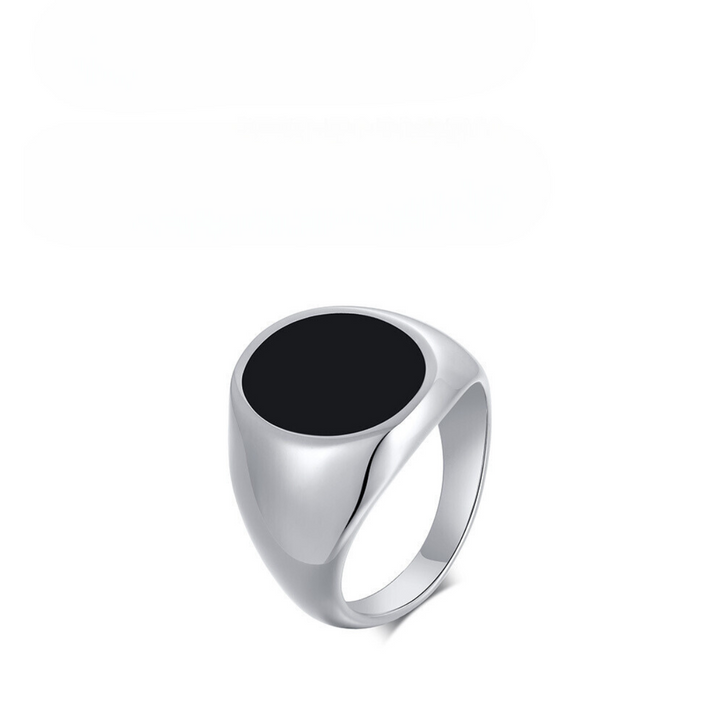 A silver signet ring with a large, round black stone set on top, crafted from stainless steel with a polished finish, displayed against a plain white background.