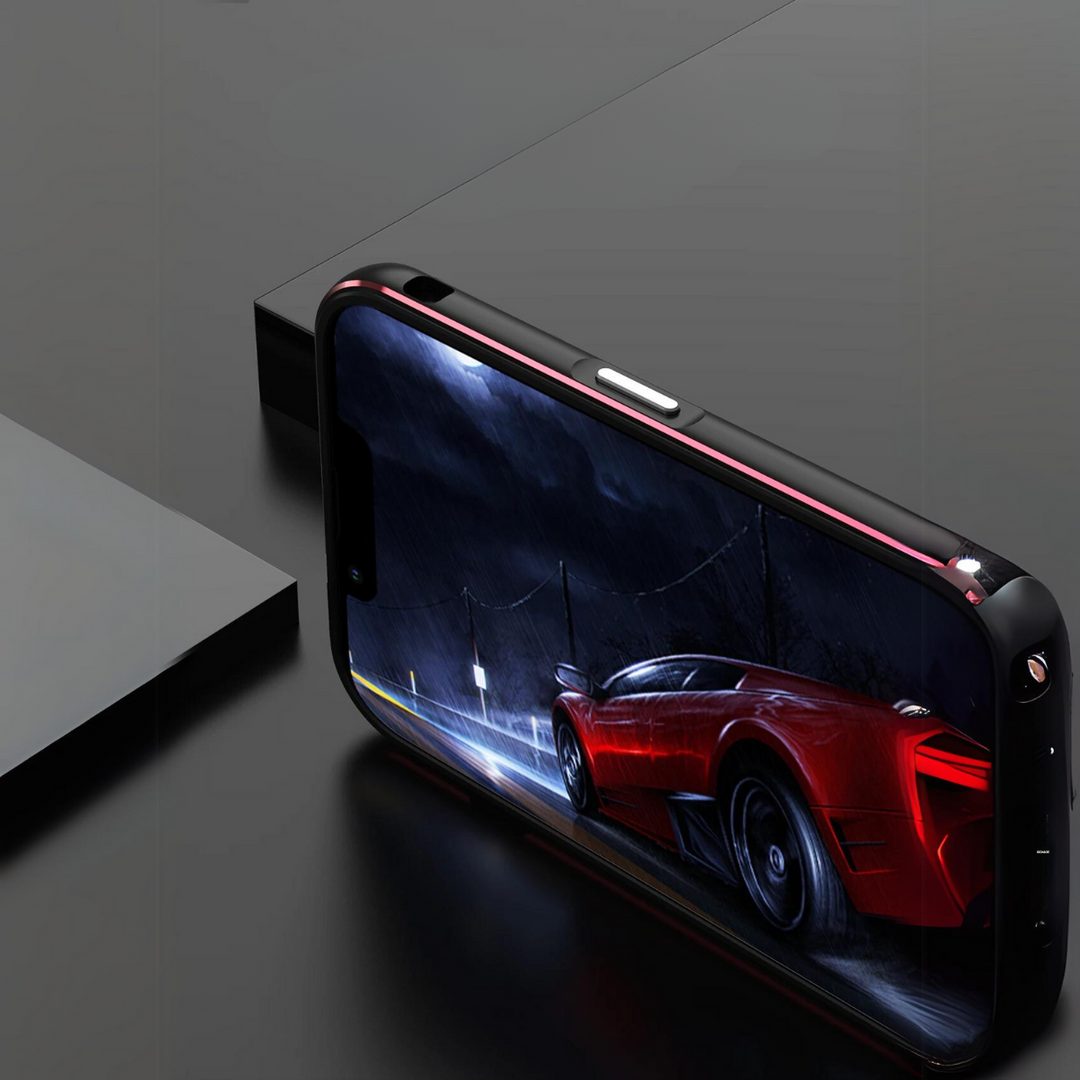 A smartphone with a red aluminum case lies on its side on a black surface, displaying an image of a red sports car driving on a rainy, dark street at night.