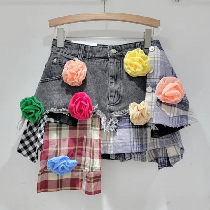 A patchwork skirt adorned with flowers, perfect for those who love eclectic fashion.