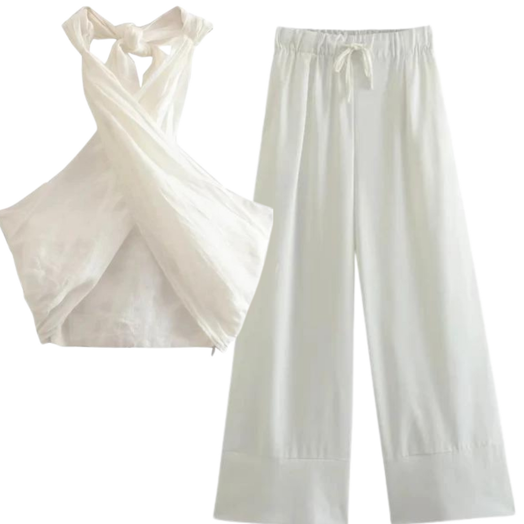 A chic halter collar defines this white sleeveless top with a crisscross front, paired effortlessly with loose, wide-leg pants featuring an elastic waistband and drawstring for easy summer style.