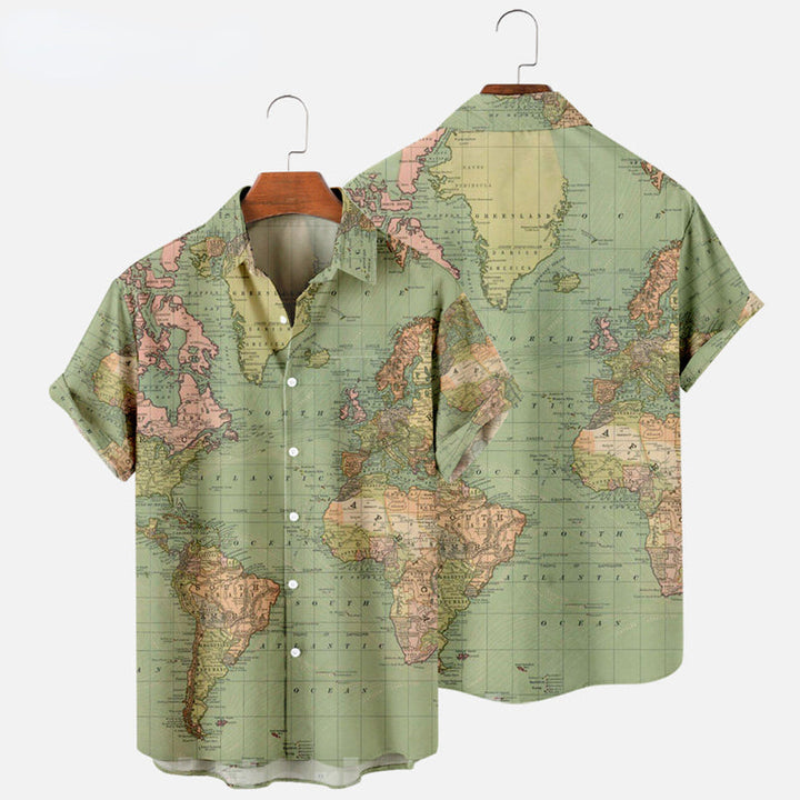 Short-sleeve button-up shirt with a vintage world map print in muted green, pink, and beige tones—perfect for adding a unique twist to your summer wardrobe. Displayed on a hanger with both front and back visible.