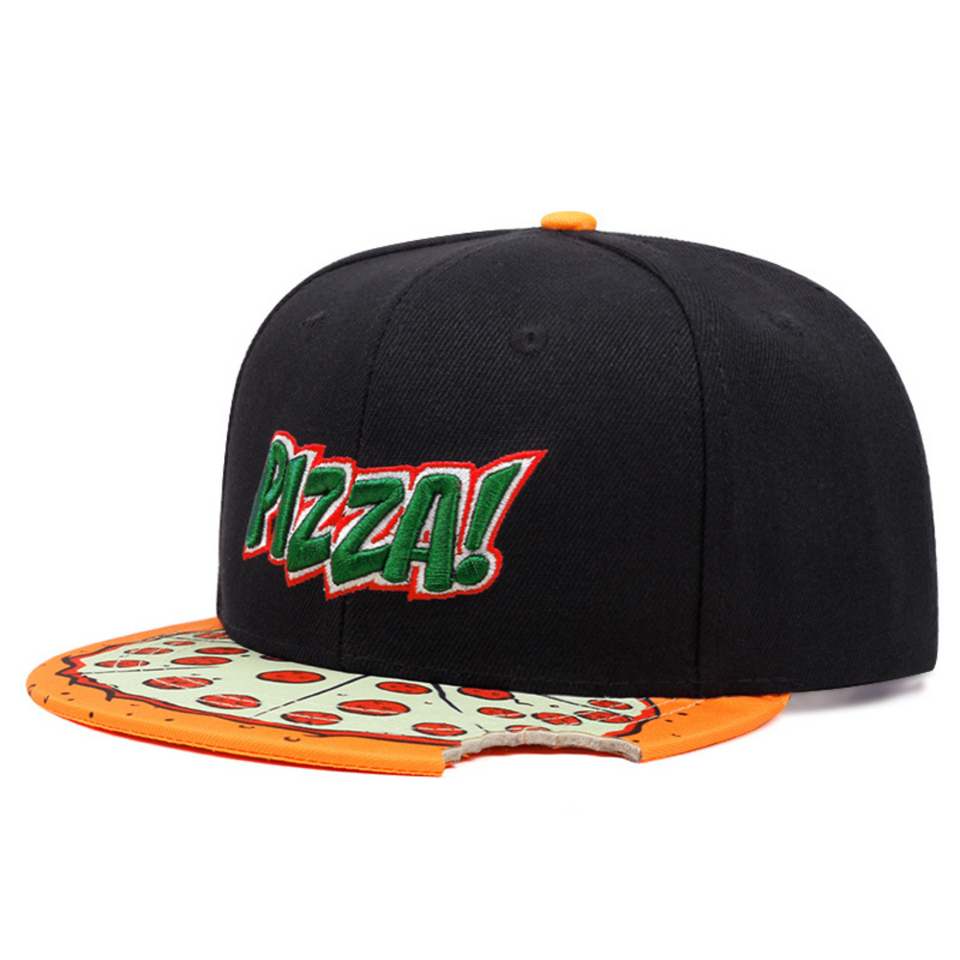 A black snapback cap with PIZZA! in green and red letters on the front. This unique brim hat features a pepperoni pizza slice design with a bite taken out of one side, making it a bold statement piece.