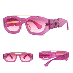 Bold, pink geometric sunglasses with thick frames, gold accents, and UV400 protection tinted lenses shown from the front, side, and angled view. Decorative details featured on the sides of the arms.