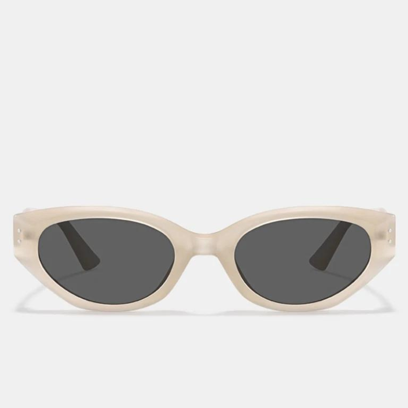 A pair of sunglasses with thick, cream-colored oval frames crafted from translucent acetate and dark UV400 protection lenses, displayed against a plain light background.