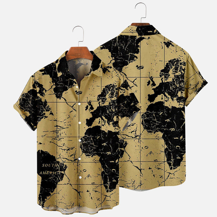 A short-sleeve button-up shirt with a beige background features a black world map print—perfect for updating your summer wardrobe. The image displays both the front and back views of the shirt on hangers.