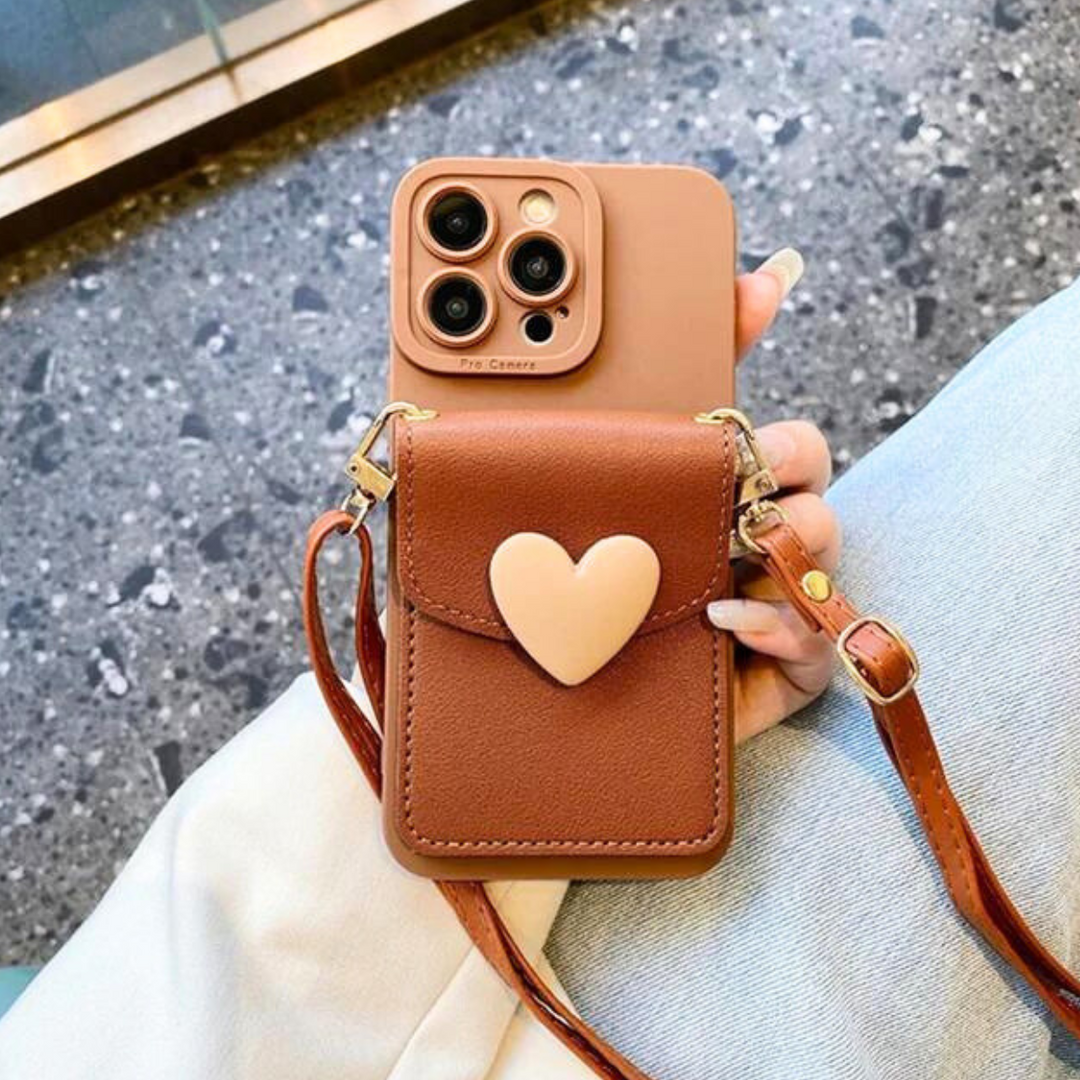 A person holding a chic phone case with a heart-shaped pocket.