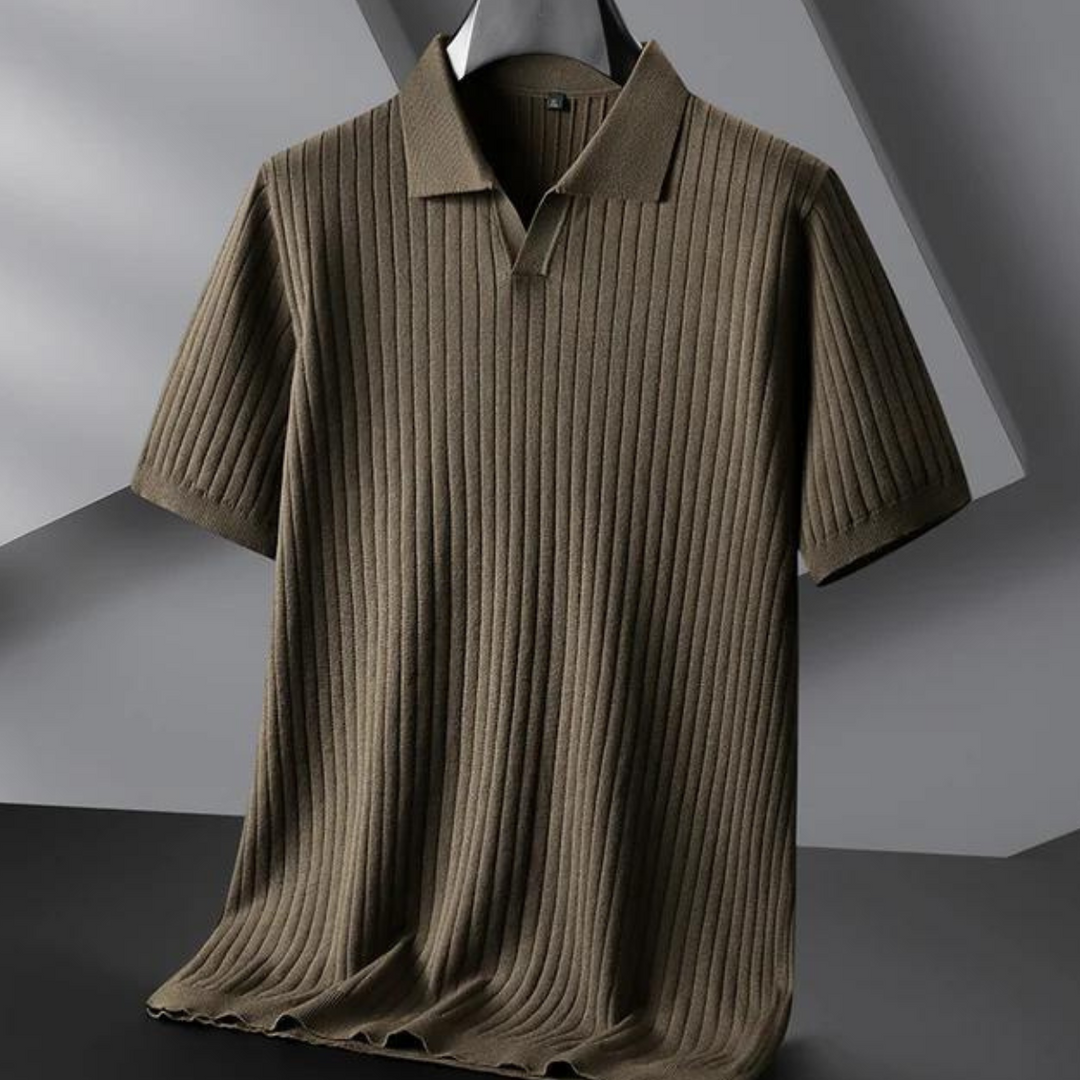 A brown, short-sleeved ribbed knit polo shirt is displayed on a hanger against a modern, geometric background—perfect for the urban professional seeking style and comfort.