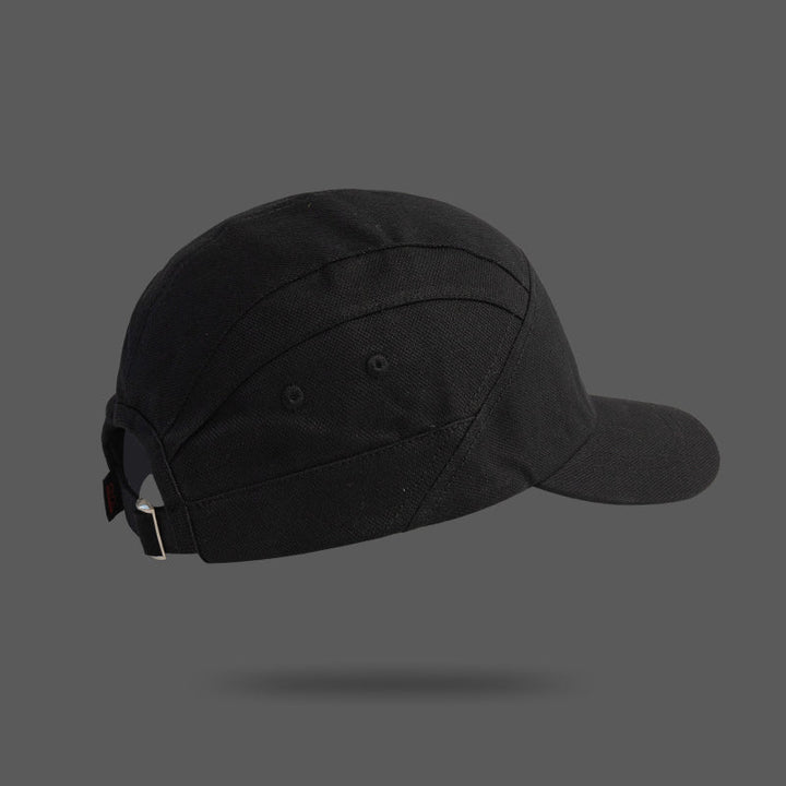 A black unisex cap shown from the back and side, featuring a metal buckle and adjustable strap, set against a plain gray background with a subtle shadow underneath.