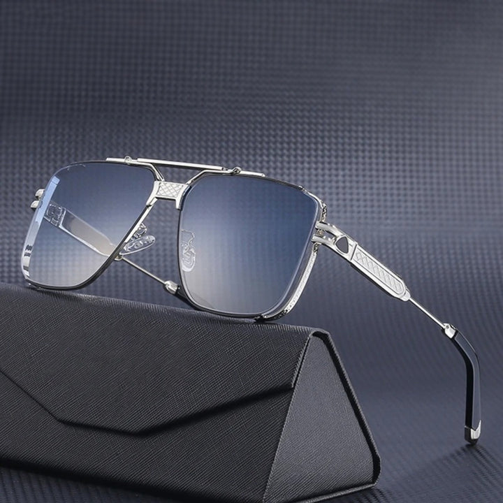 A pair of stylish vintage sunglasses with silver metal frames and blue gradient, anti-glare lenses is displayed on top of a black, textured glasses case against a dark patterned background.