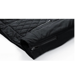 A close-up view of a black, wind-resistant quilted jacket sleeve with a visible zipper on the cuff and another zipper pocket above it, displayed on a white background.