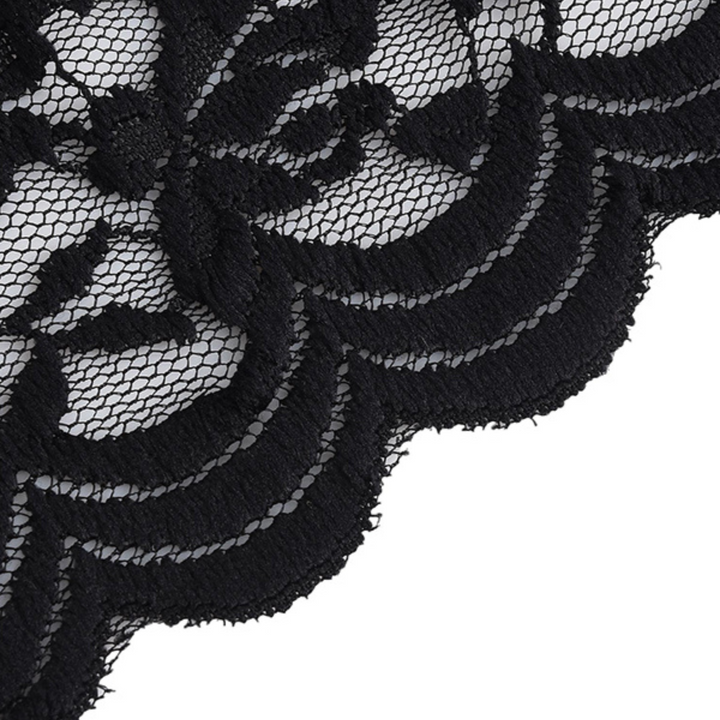 Close-up of black lace fabric with an intricate floral pattern and scalloped edges on a white background, perfect for a chic lace top in summer fashion.