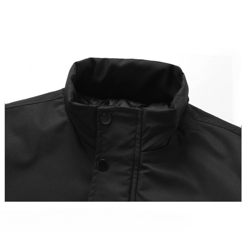 A close-up of the upper section of a black windproof jacket with a high collar and snap buttons, displayed against a white background.