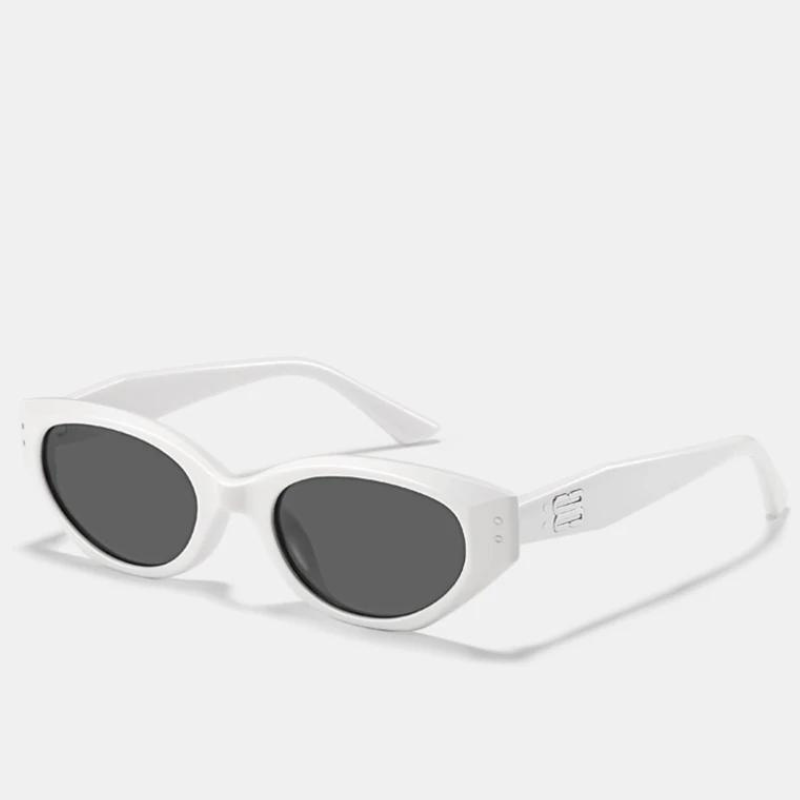White oval sunglasses with dark lenses and a thick translucent acetate frame, shown on a plain white background. The wide arms feature a subtle embossed logo detail, while the scratch-resistant lenses offer reliable UV400 protection.
