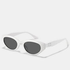 White oval sunglasses with dark lenses and a thick translucent acetate frame, shown on a plain white background. The wide arms feature a subtle embossed logo detail, while the scratch-resistant lenses offer reliable UV400 protection.