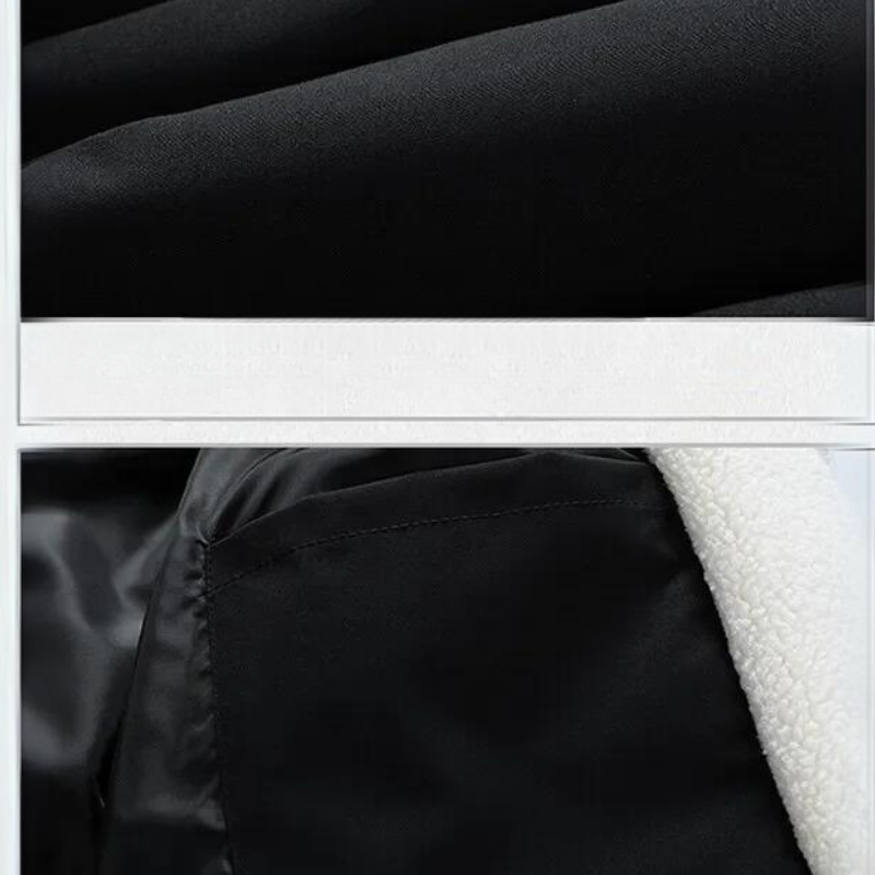 Close-up of a black fabric jacket featuring a contrast white fleece-lined interior visible along the edge and interior pocket area.