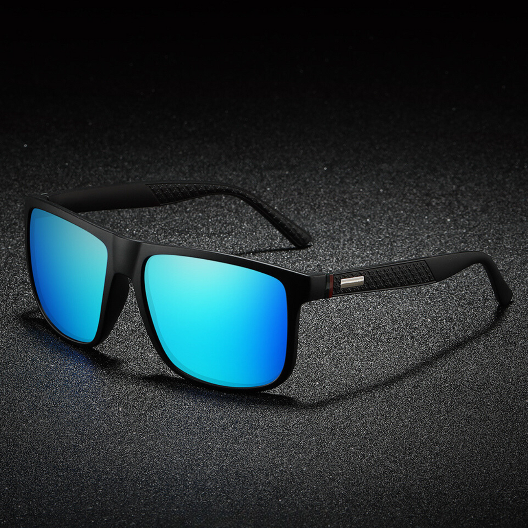A pair of stylish sunglasses with large, rectangular blue mirrored lenses rests on a textured dark surface under dramatic lighting, blending bold design with modern appeal.